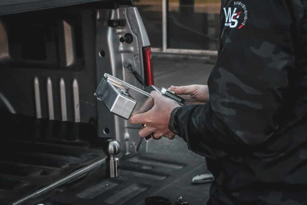 man holding weigh safe drop hitch